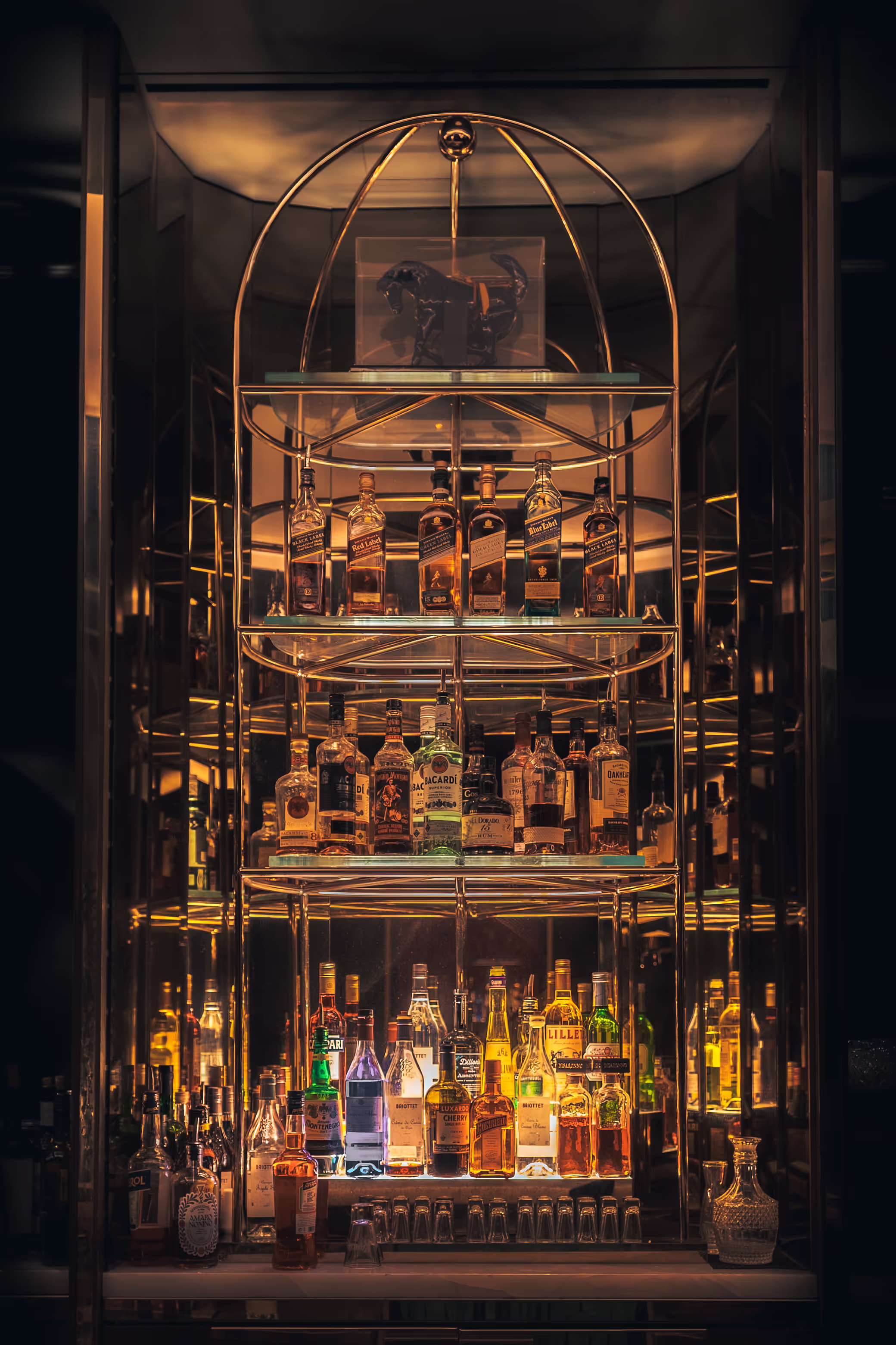 Backlit liquor display at Mr. C bar in the Bisha Hotel, Toronto, photographed by Jasmine Tam